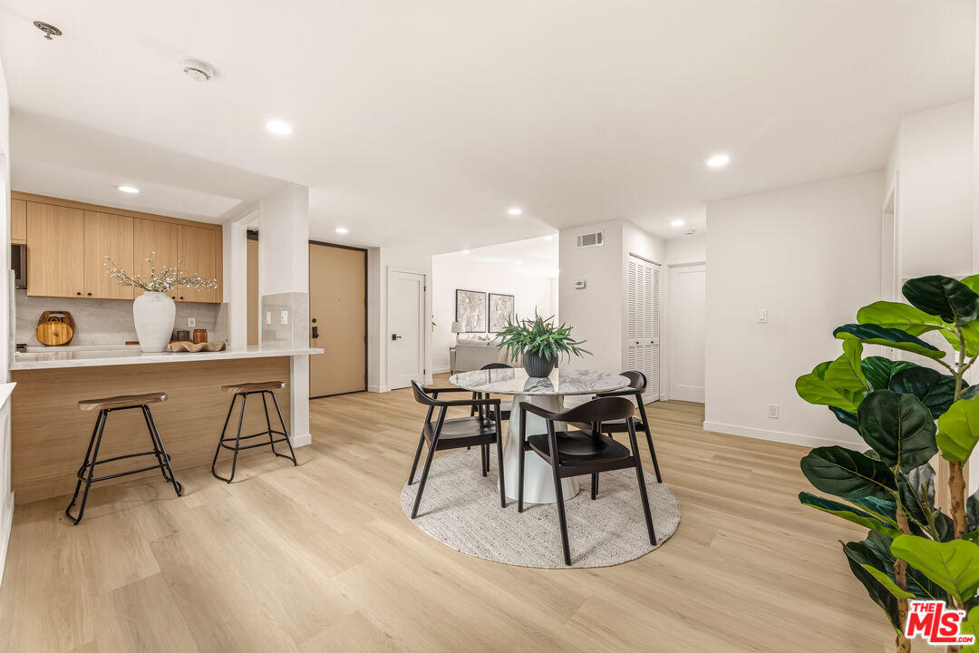 311 Bora Bora Way, Unit 3207 Marina del Rey, CA 90292 - Photo 10 of 54 a view of a dining room with furniture and wooden floor