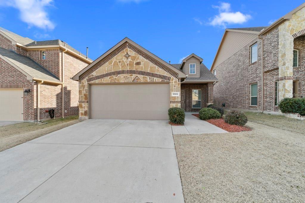 9901 Pronghorn Road McKinney, TX 75071 - Photo 1 of 27 a front view of a house with a yard and garage