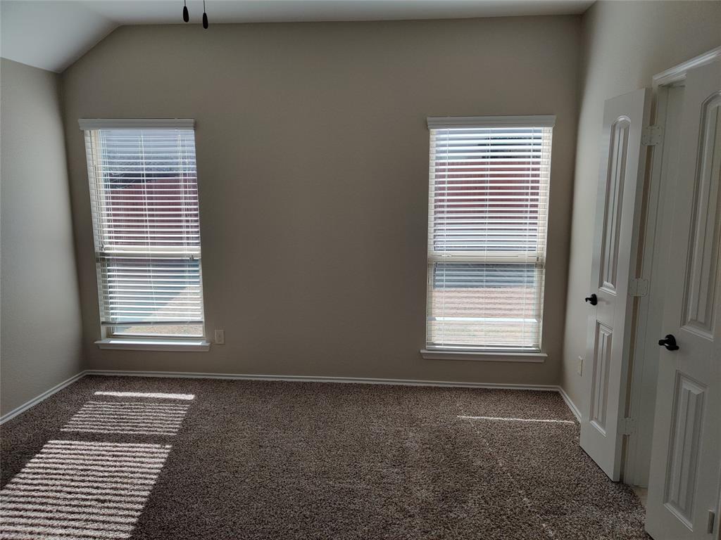 9901 Pronghorn Road McKinney, TX 75071 - Photo 17 of 27 a view of an empty room with a window