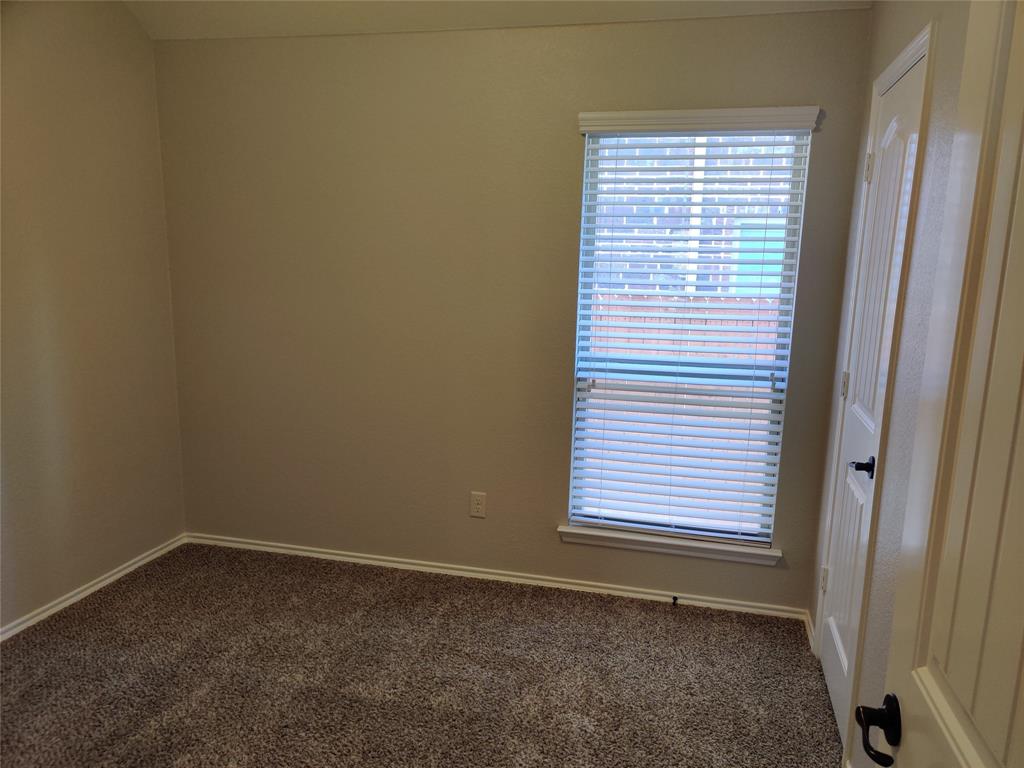 9901 Pronghorn Road McKinney, TX 75071 - Photo 23 of 27 an empty room with a window