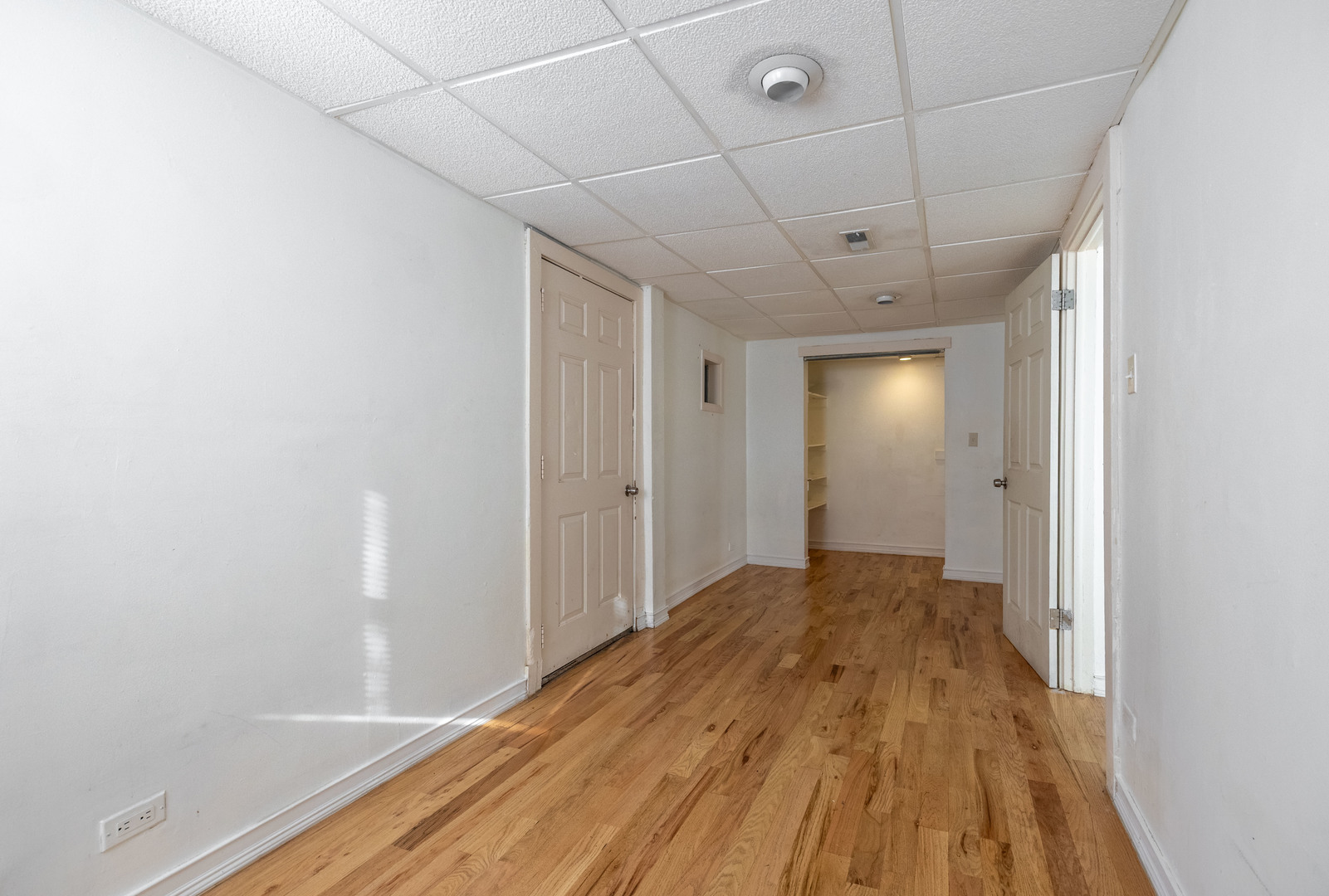 3248 West 25th Street, Unit 2 Chicago, IL 60623 - Photo 12 of 17 a view of a big room with wooden floor
