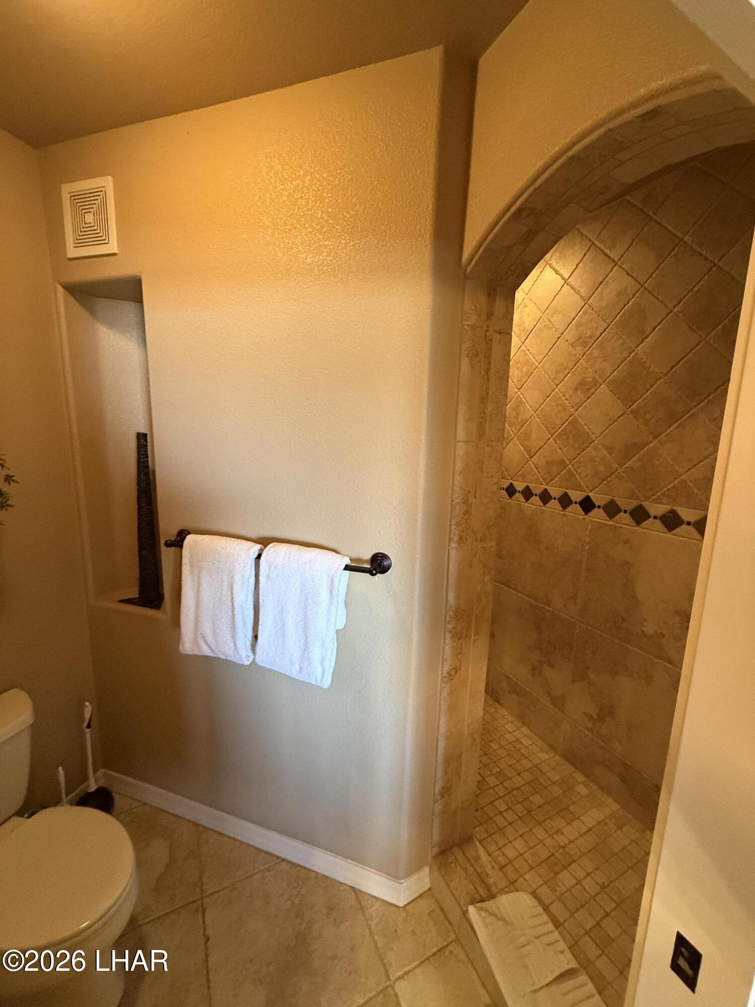 433 London Bridge Road, Unit B101 Lake Havasu City, AZ 86403 - Photo 29 of 35 a bathroom with a shower
