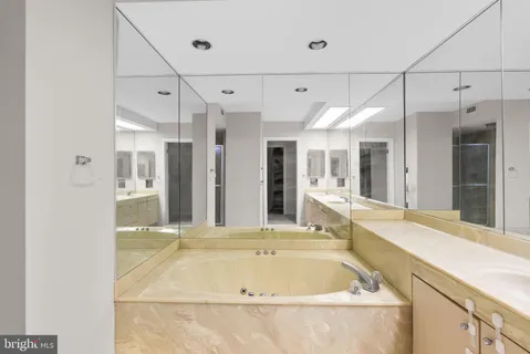 a bathroom with a tub and sink