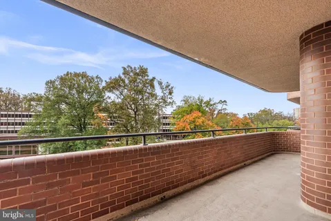 a view of balcony with furniture