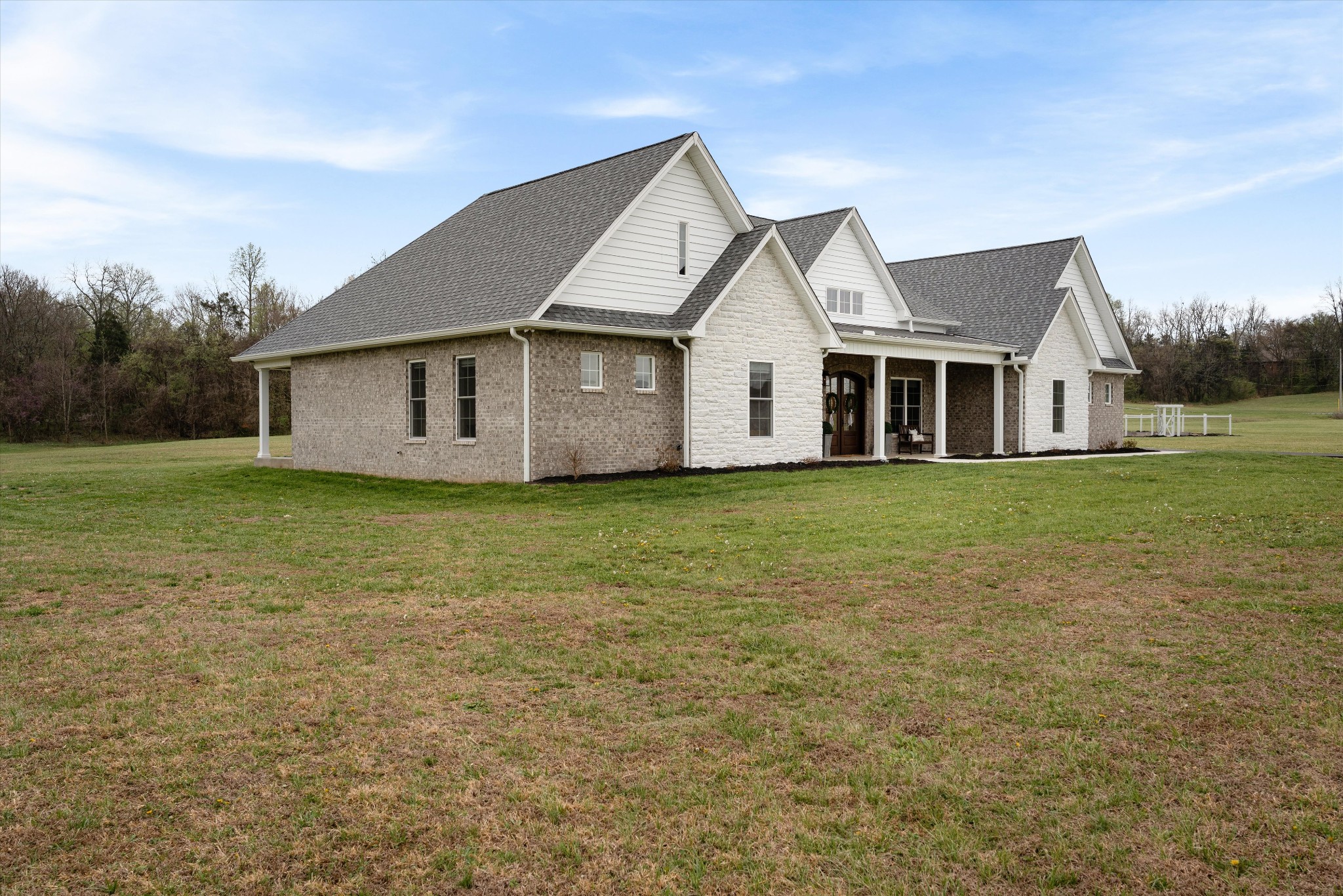 4057 Calista Road Cross Plains, TN 37049 - Photo 14 of 92 a front view of a house with a garden