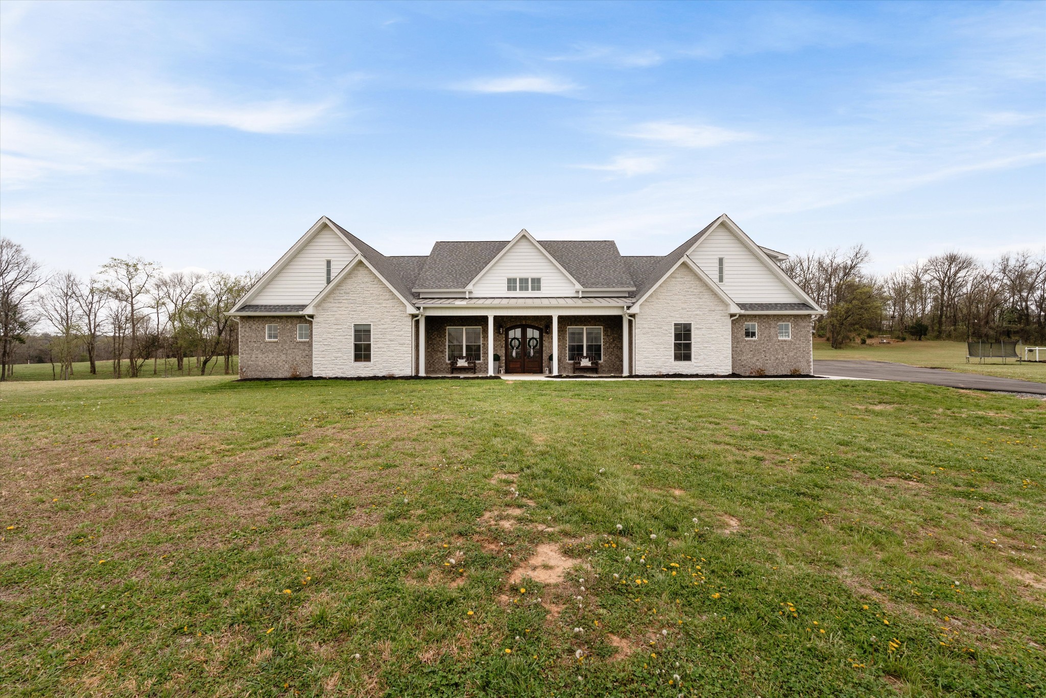 4057 Calista Road Cross Plains, TN 37049 - Photo 15 of 92 a front view of a house with a yard