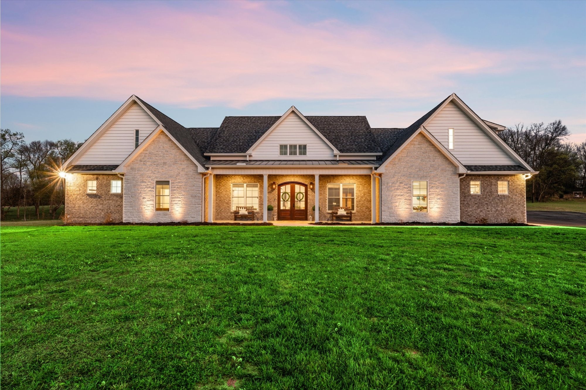 4057 Calista Road Cross Plains, TN 37049 - Photo 2 of 92 a front view of a house with a yard and garage