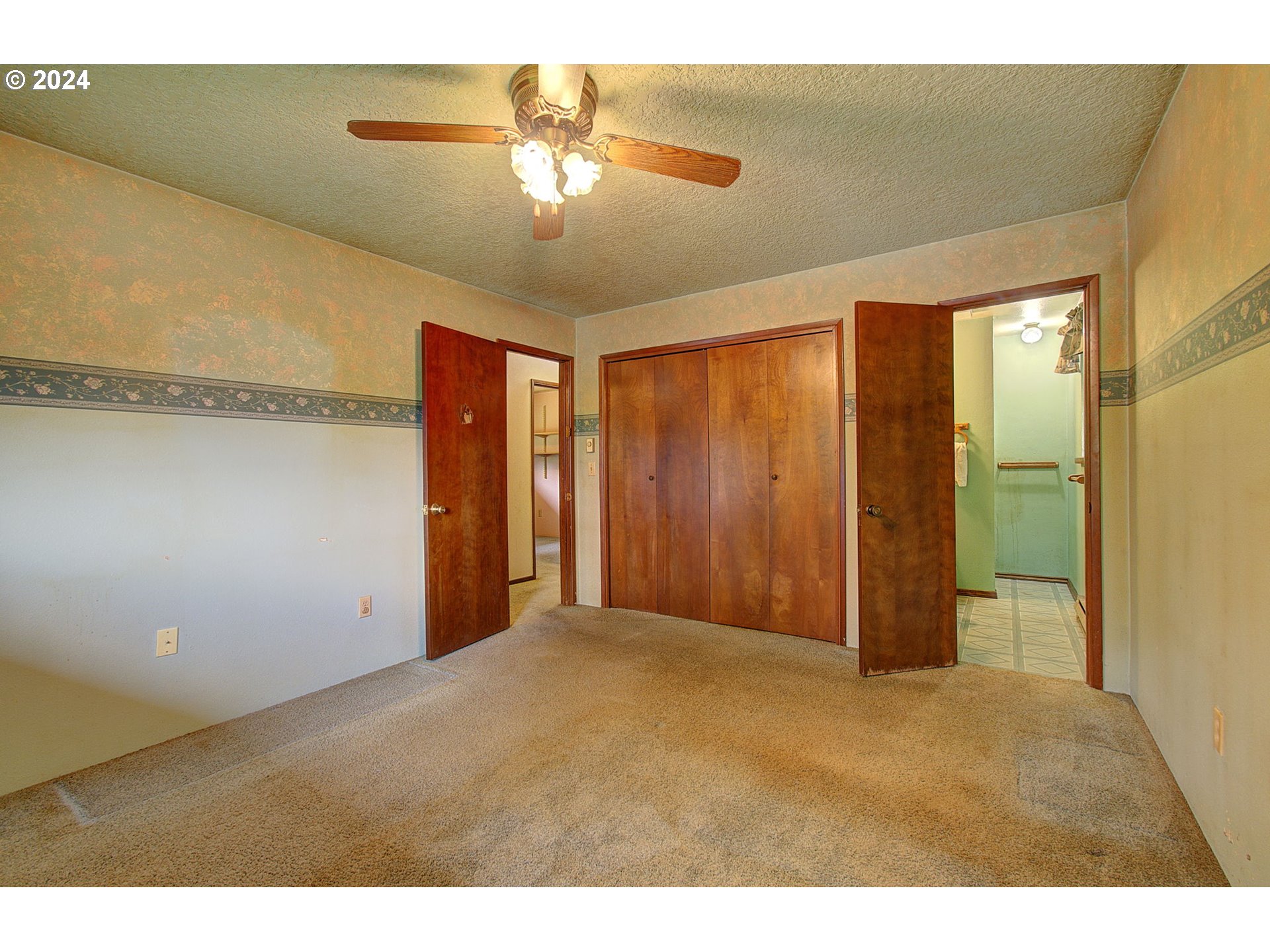 111 Backstrom Road Winlock, WA 98596 - Photo 19 of 30 a view of an empty room with a chandelier