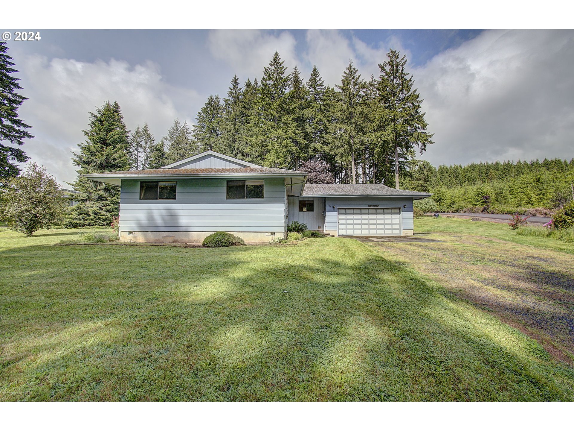 111 Backstrom Road Winlock, WA 98596 - Photo 3 of 30 a front view of a house with garden