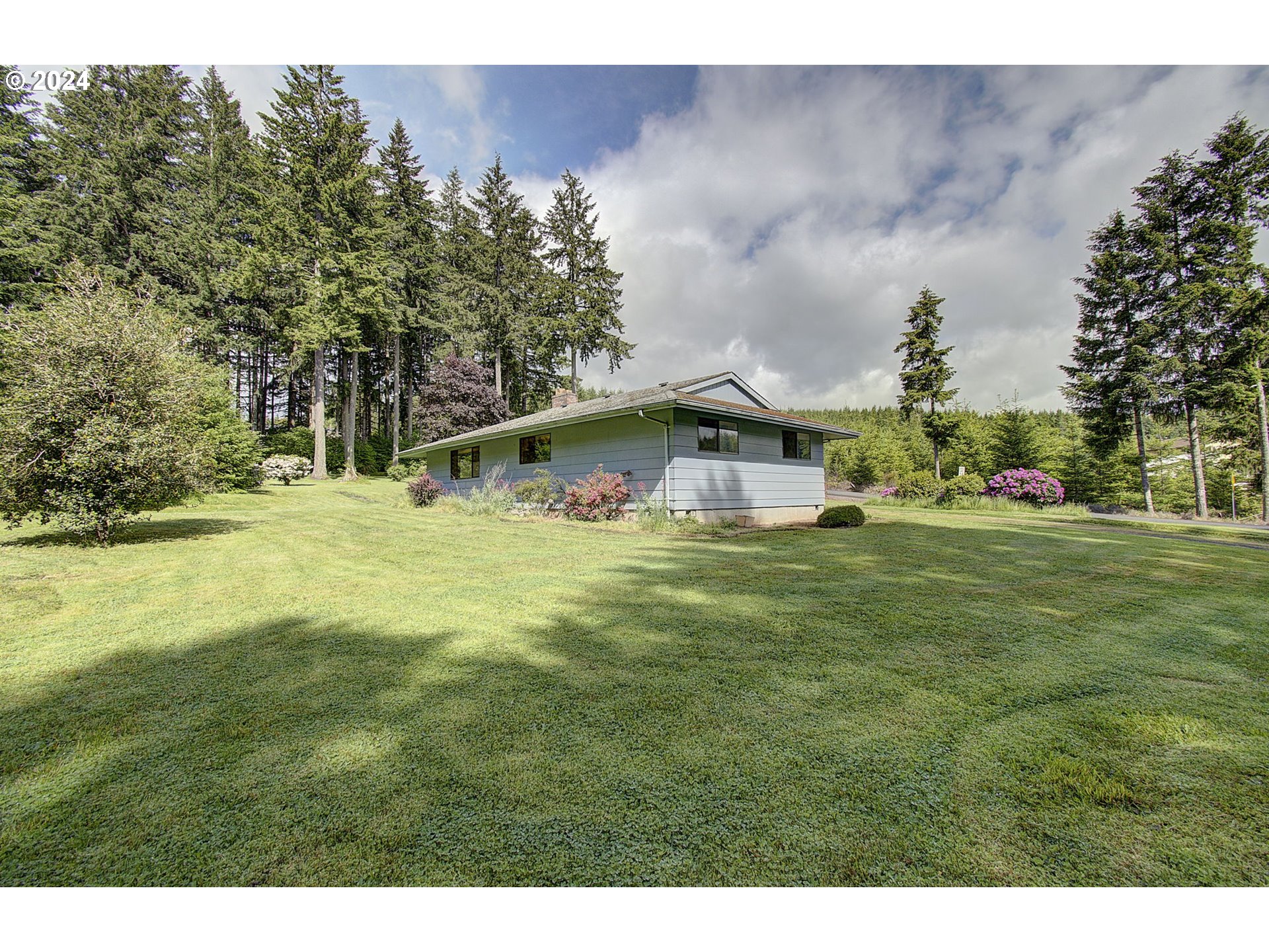 111 Backstrom Road Winlock, WA 98596 - Photo 4 of 30 a backyard of a house with lots of green space