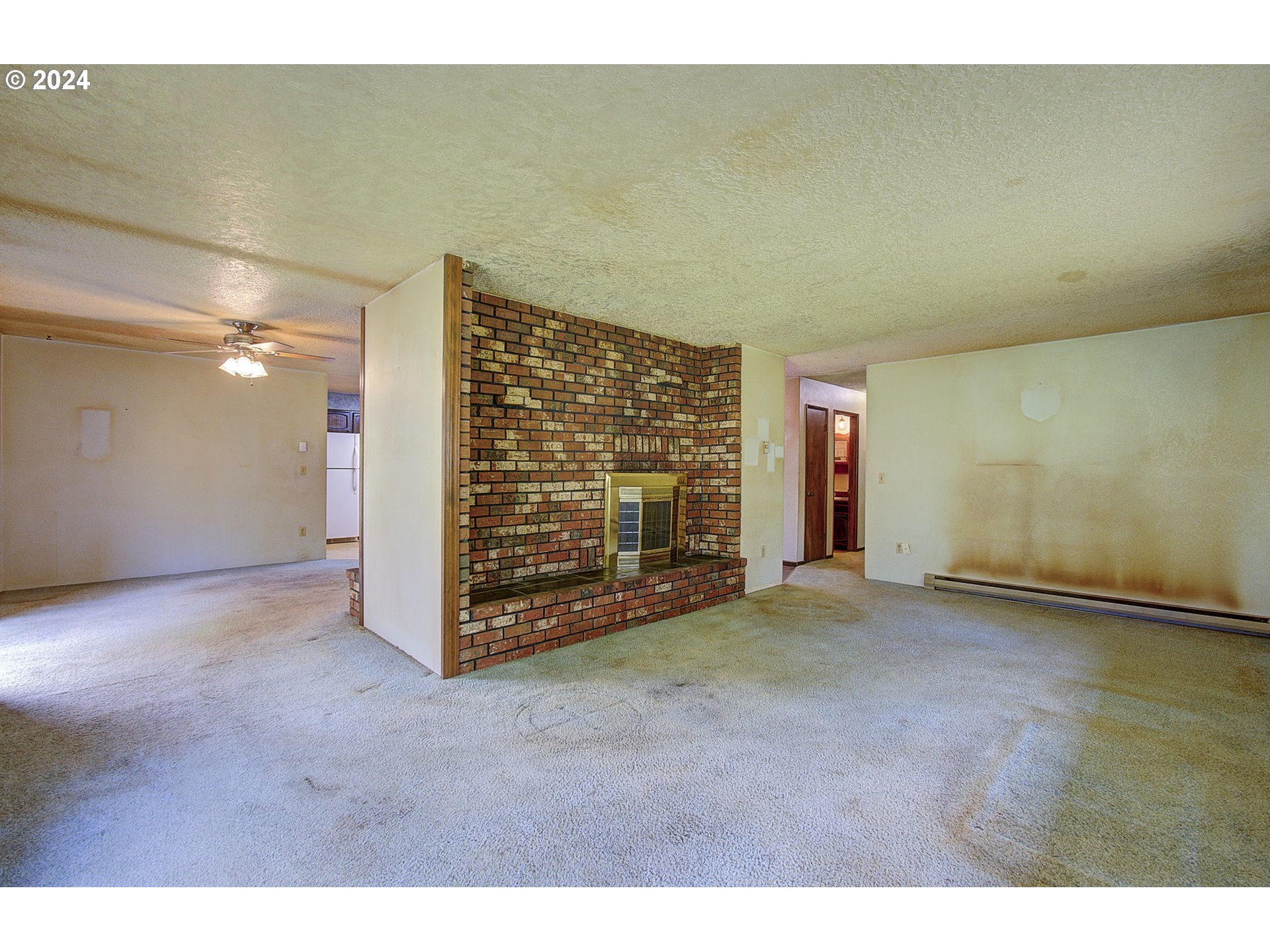 111 Backstrom Road Winlock, WA 98596 - Photo 7 of 30 a view of an empty room with a fireplace