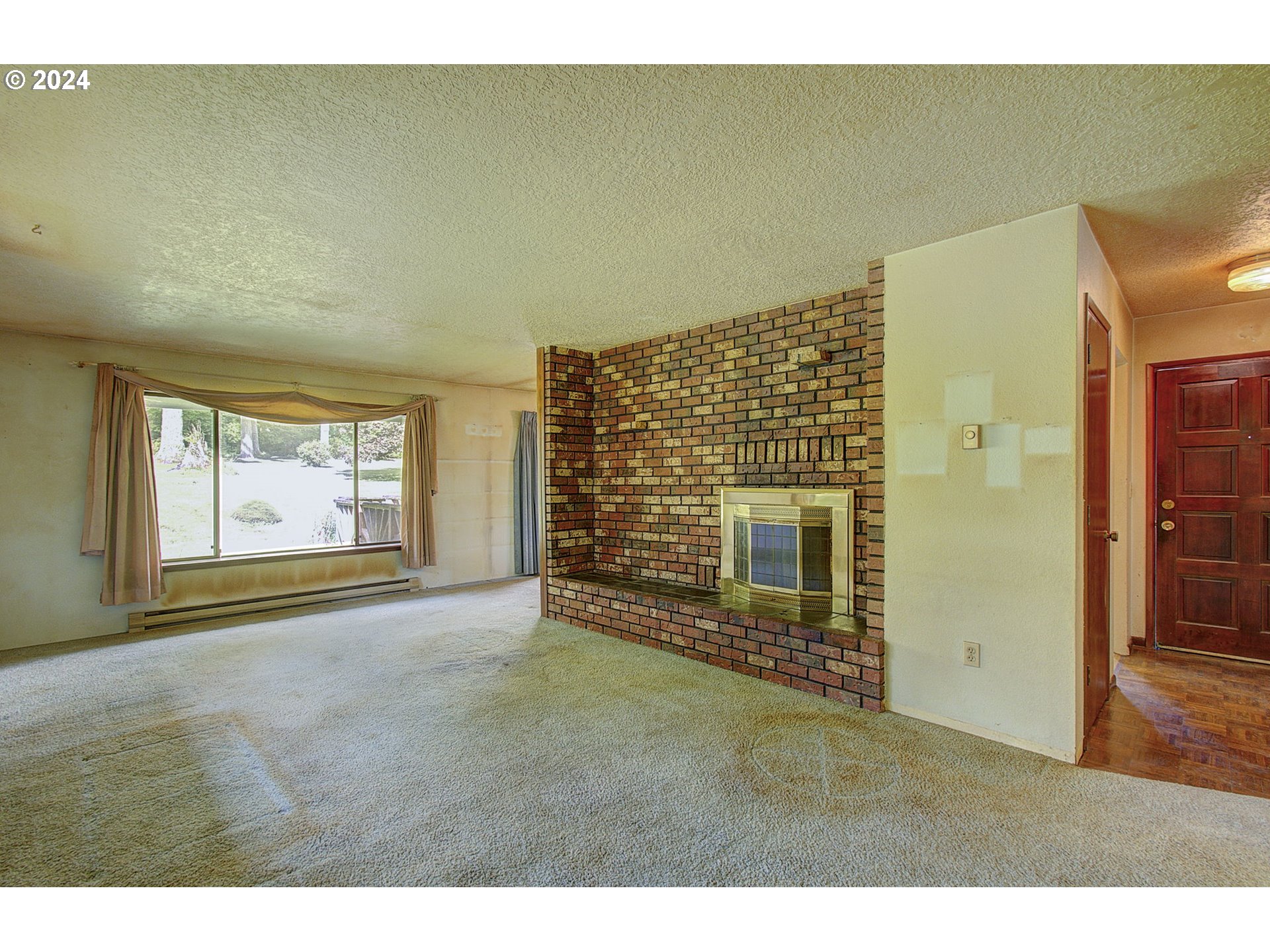 111 Backstrom Road Winlock, WA 98596 - Photo 8 of 30 a view of an empty room with a fireplace