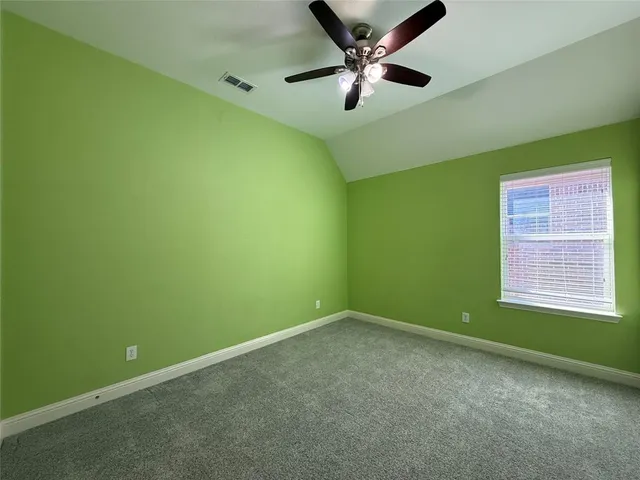 a view of a big room with windows