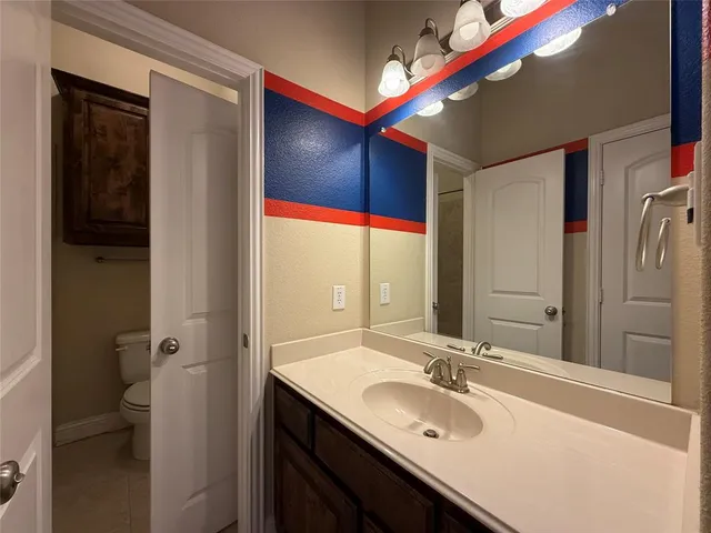 a bathroom with a toilet a sink and bathtub