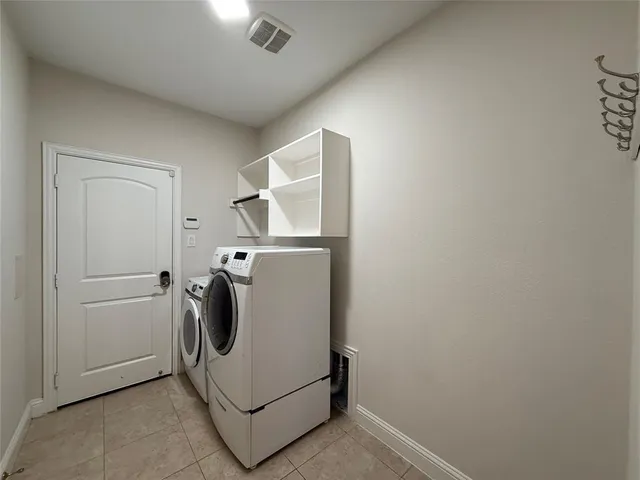 a view of a swimming pool with a patio and a yard