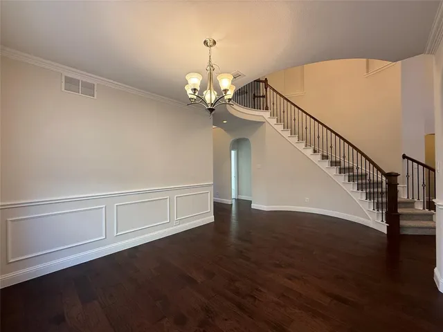 a view of a livingroom with wooden floor