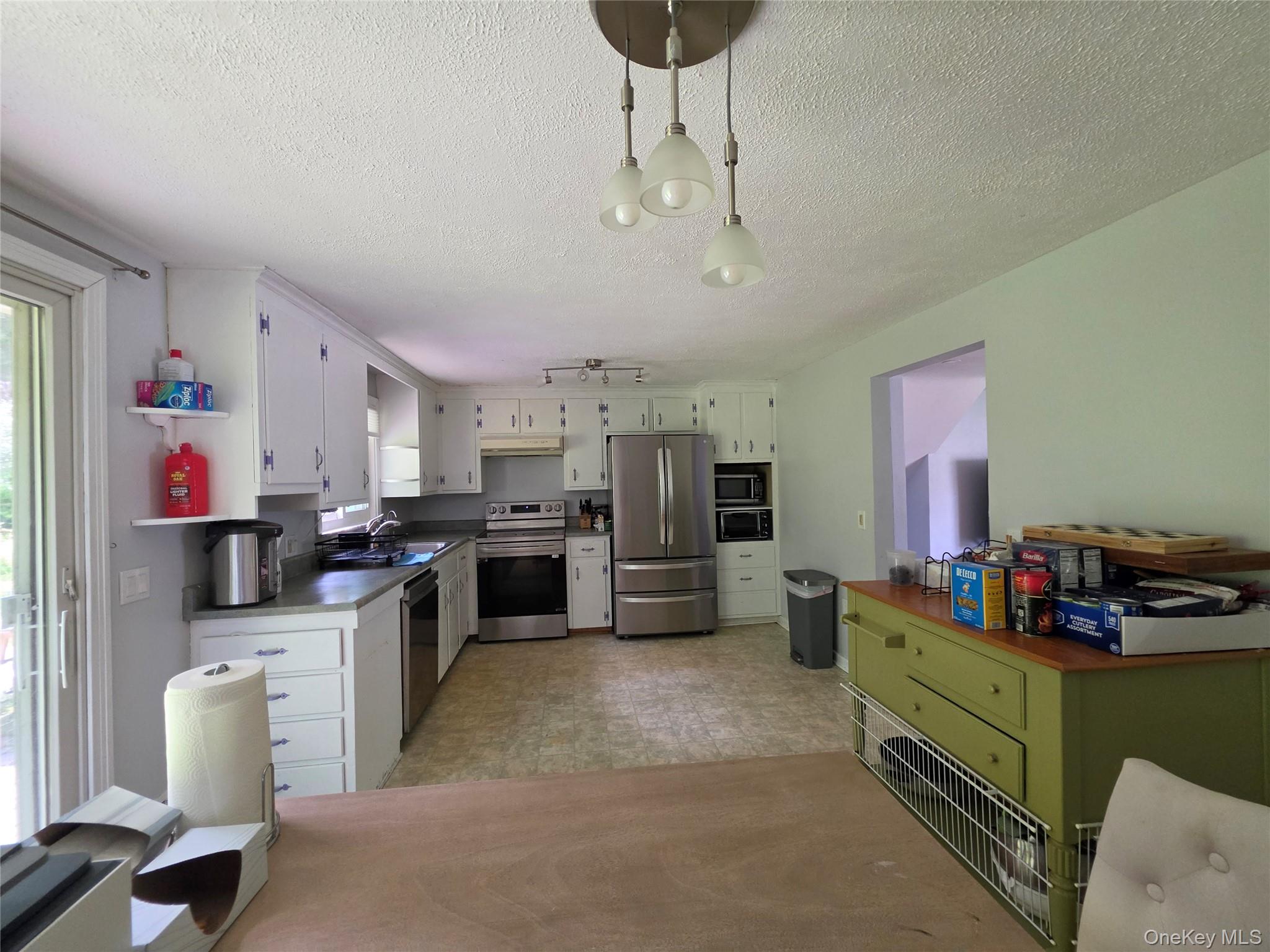 4804 Country Club Road Vestal, NY 13850 - Photo 5 of 15 a kitchen that has a lot of cabinets and refrigerator