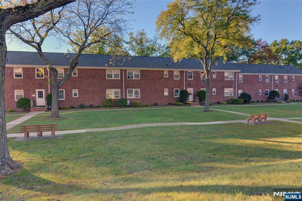 255 Bogert Road, Unit 2A River Edge, NJ 07661 - Photo 21 of 25 a view of a house with a big yard