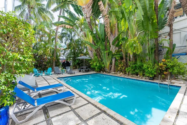 a view of swimming pool with chairs