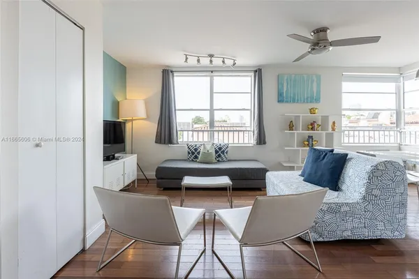 a living room with furniture and a window