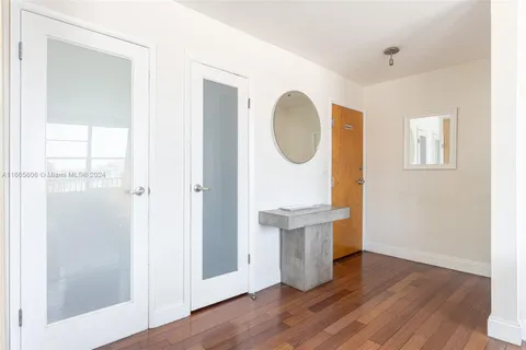 a view of entryway with wooden floor