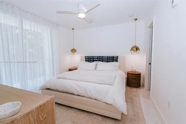 a bedroom with a bed and a table