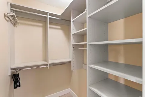 a view of an empty walk in closet