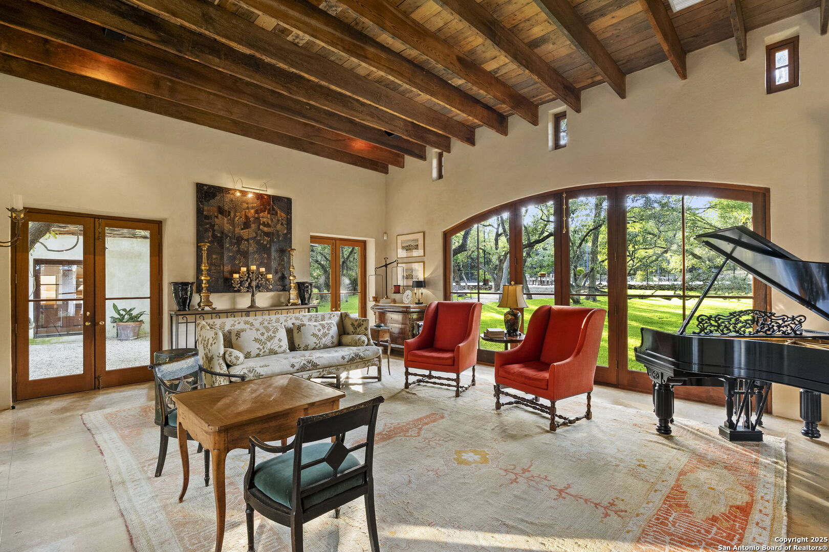 317 Limestone Crk Road Hill Country Village, TX 78232 - Photo 14 of 51 a living room with furniture a table and chairs next to a window