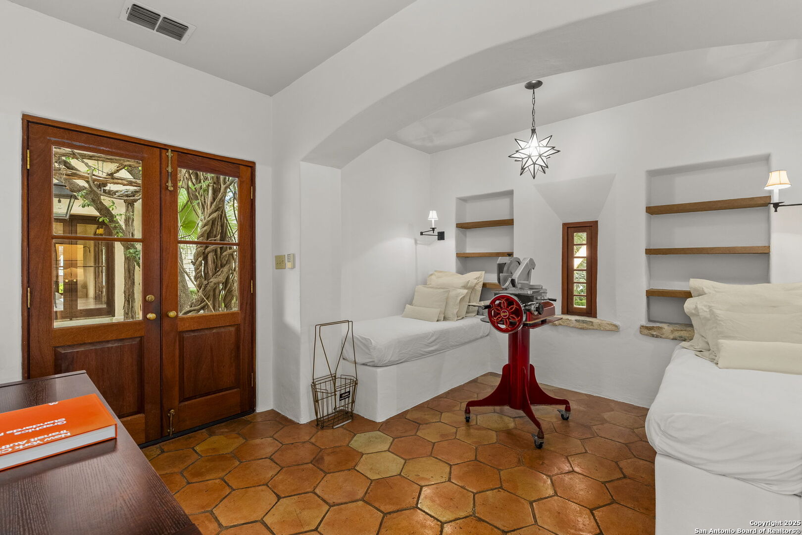 317 Limestone Crk Road Hill Country Village, TX 78232 - Photo 32 of 51 a living room with furniture a chandelier and large window