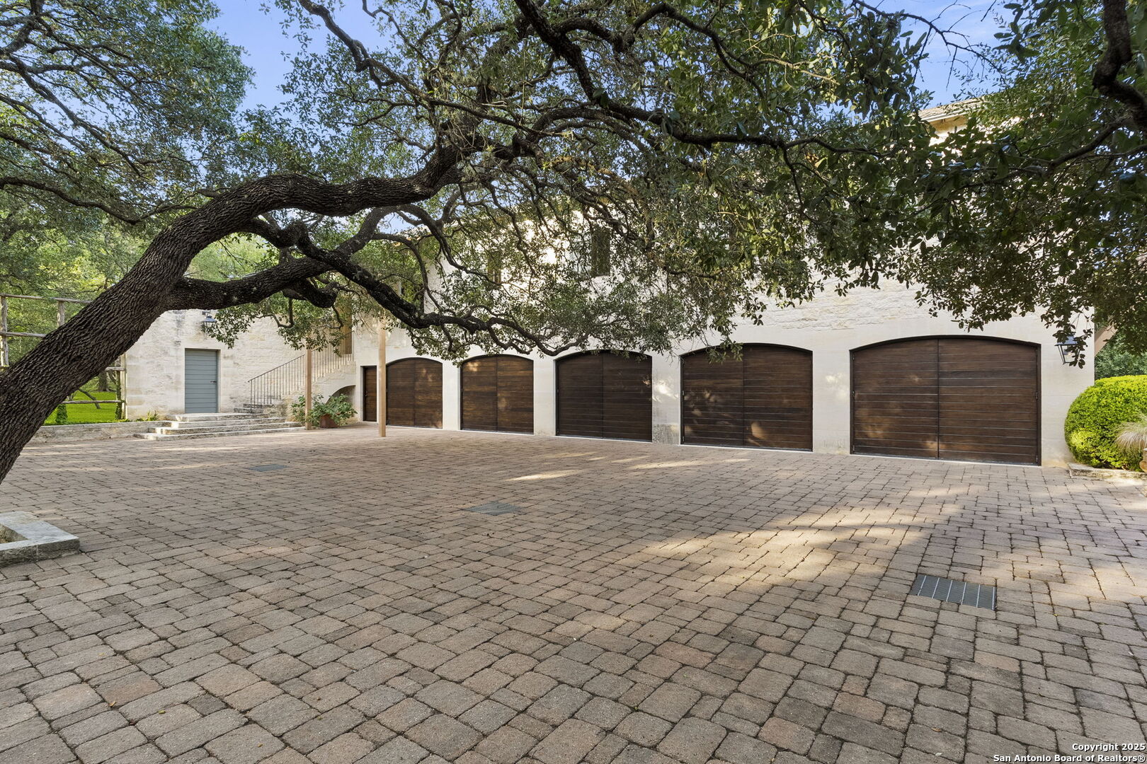 317 Limestone Crk Road Hill Country Village, TX 78232 - Photo 39 of 51 a front view of a house with a yard and a garage