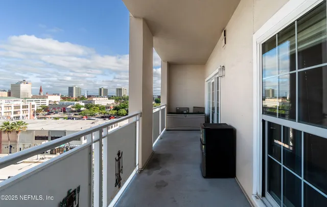 a kitchen with kitchen island granite countertop a sink and cabinets