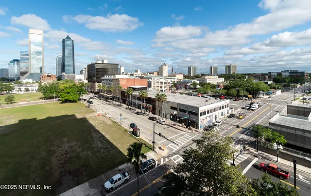 a bed room with a bed and a chandelier