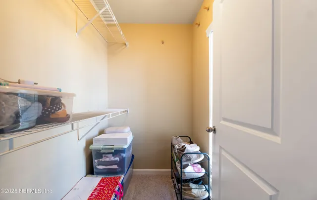 a bathroom with a sink a toilet and a large mirror
