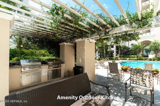 a view of swimming pool with seating space