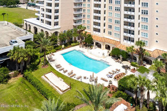 a view of a balcony with two chairs and a table