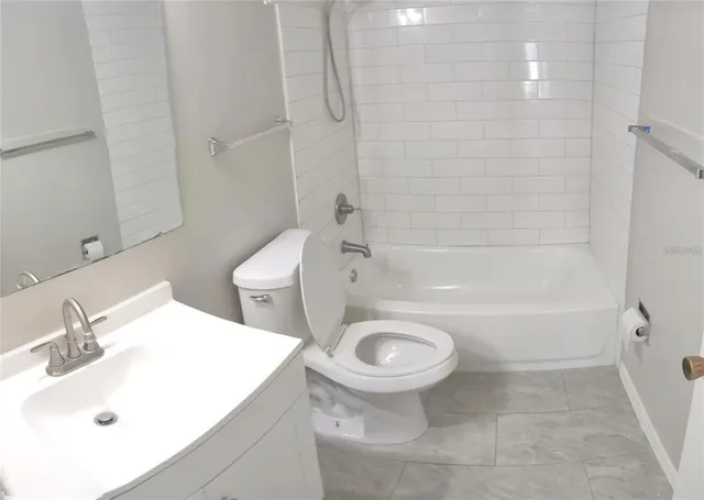 a bathroom with a sink a toilet and a bathtub