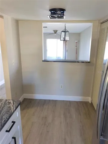 view of a room with wooden floor and cabinet