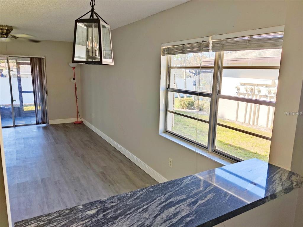 2472 Enterprise Road, Unit 6 Clearwater, FL 33763 - Photo 10 of 22 a view of room with window and wooden floor