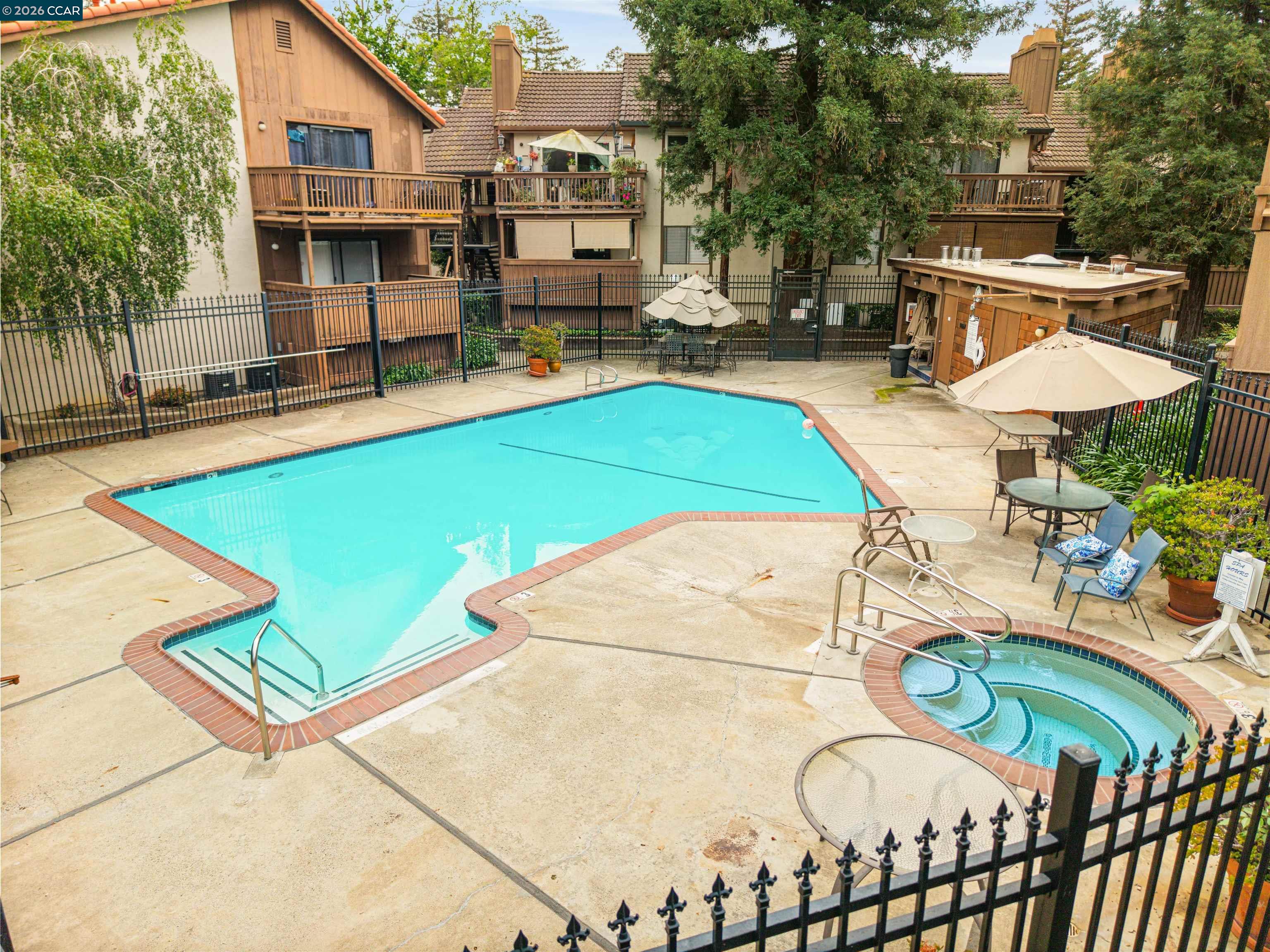2055 Sierra Road, Unit 106 Concord, CA 94518 - Photo 32 of 37 a view of a swimming pool with a patio and a yard