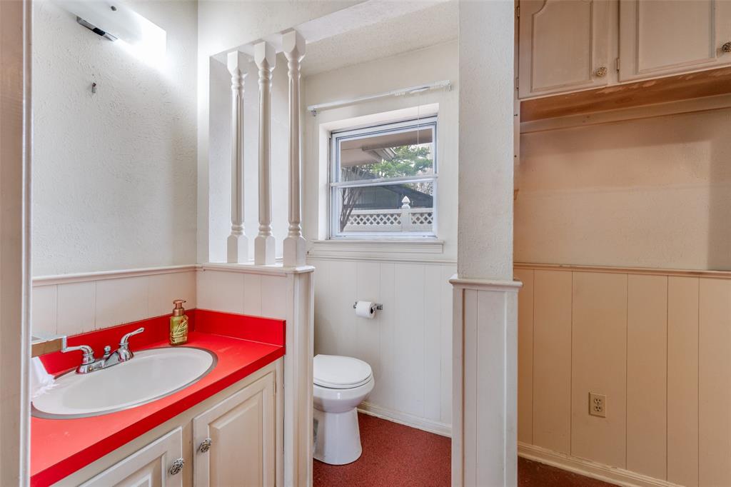 5001 Boulder Lake Road Fort Worth, TX 76103 - Photo 13 of 22 a bathroom with a sink and a mirror