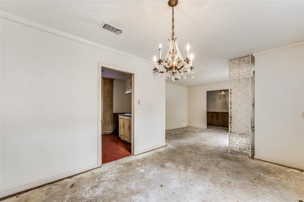 5001 Boulder Lake Road Fort Worth, TX 76103 - Photo 9 of 22 a view of a chandelier in an empty room