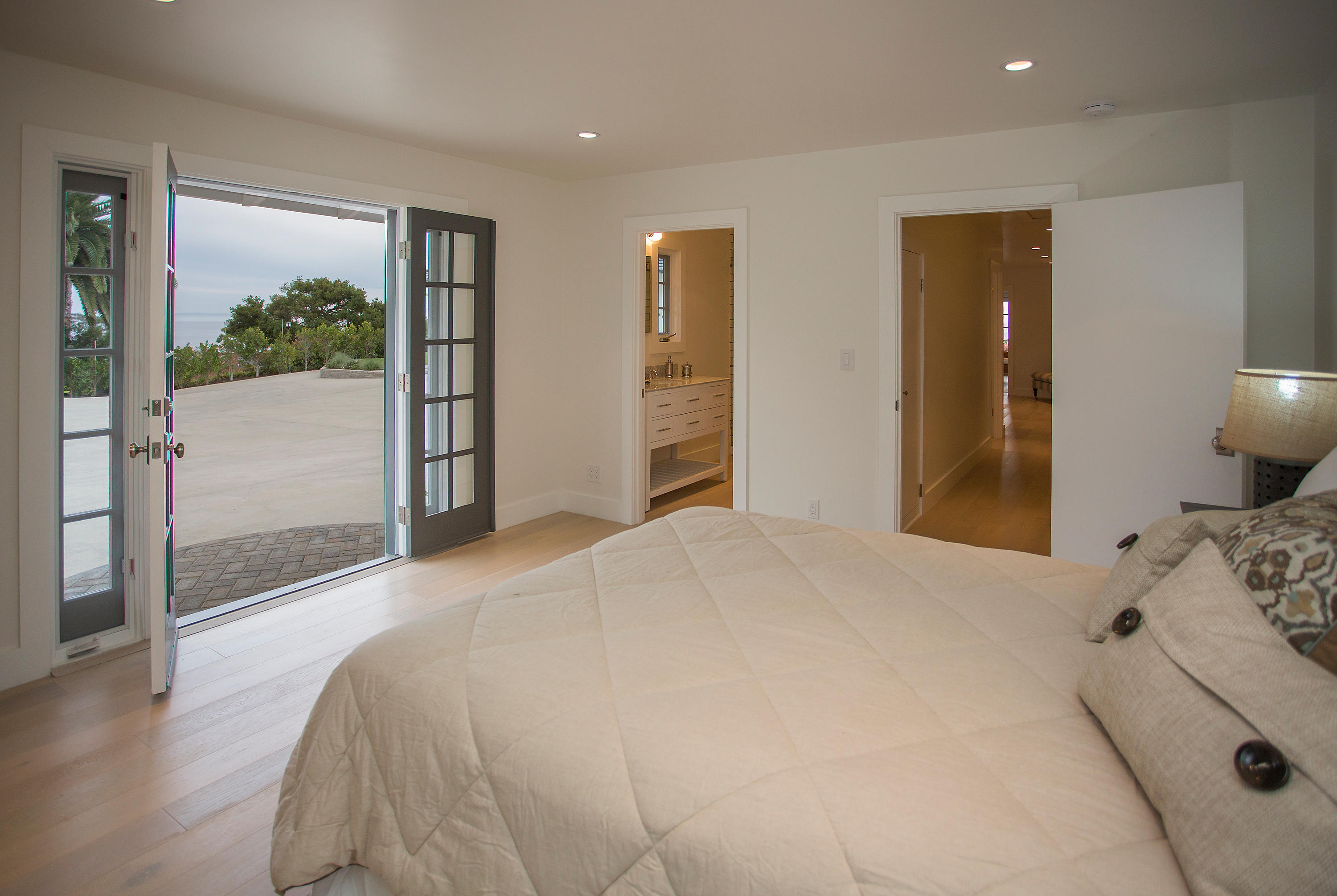 527 Meigs Road Santa Barbara, CA 93109 - Photo 11 of 30 a bedroom with a bed and glass door