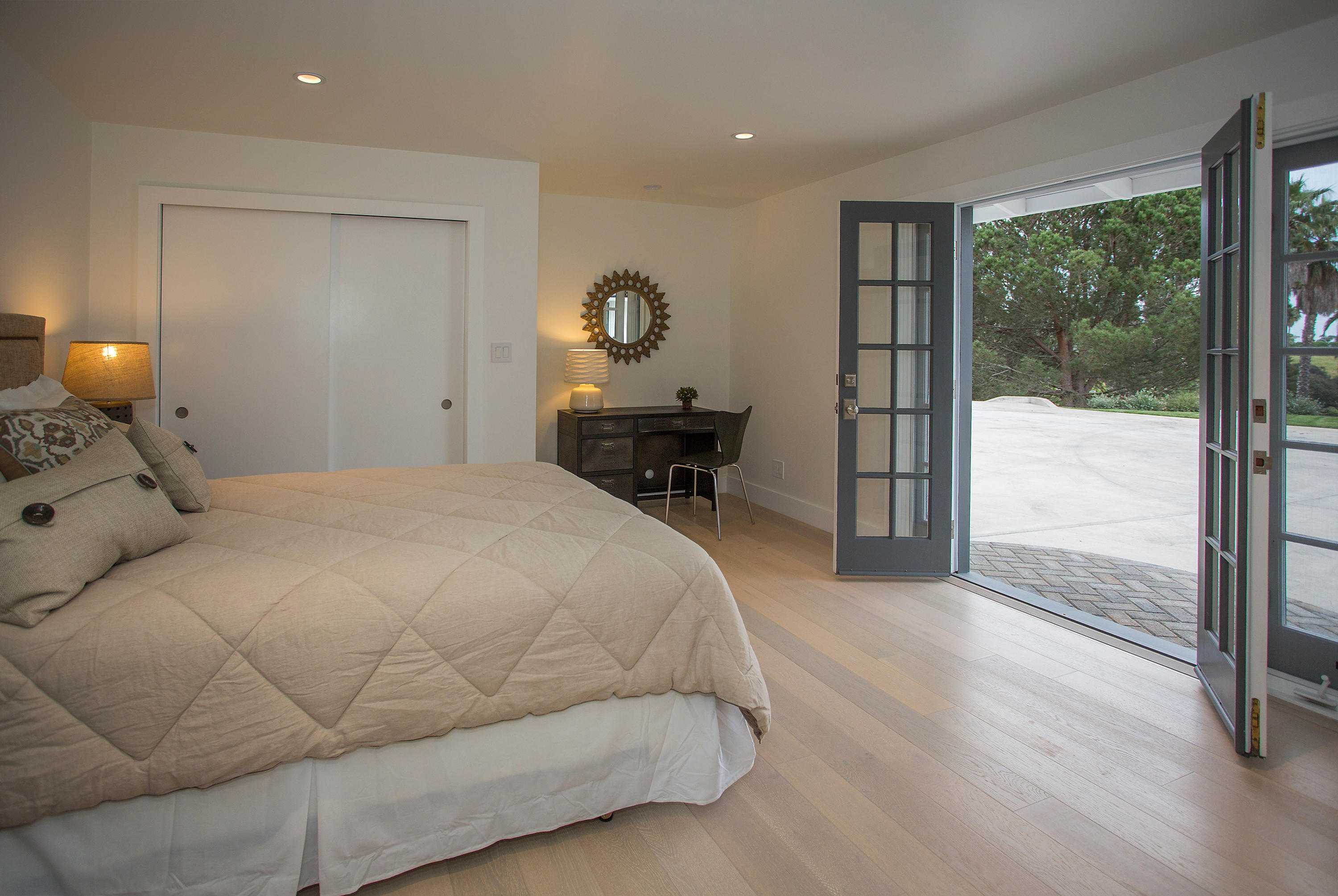 527 Meigs Road Santa Barbara, CA 93109 - Photo 12 of 30 a bedroom with a bed and large windows
