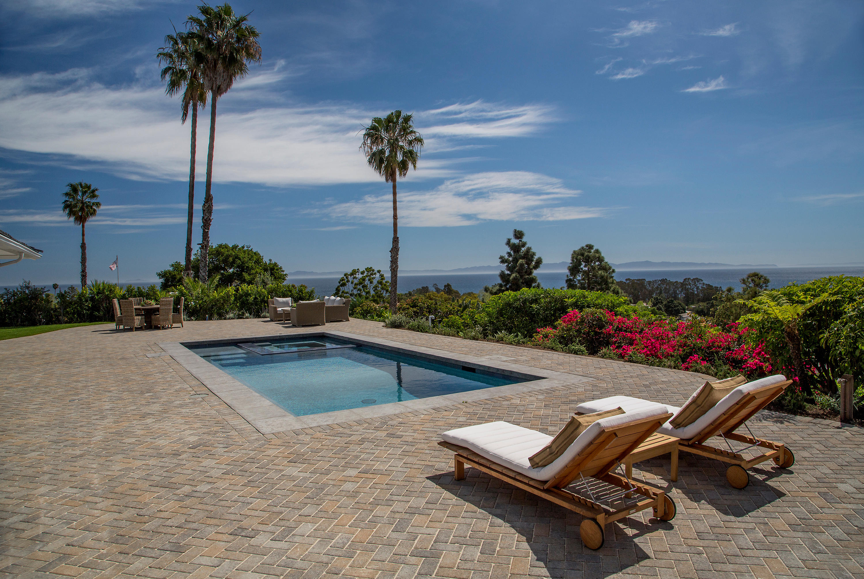 527 Meigs Road Santa Barbara, CA 93109 - Photo 27 of 30 a view of a swimming pool with a lounge chair and potted plants
