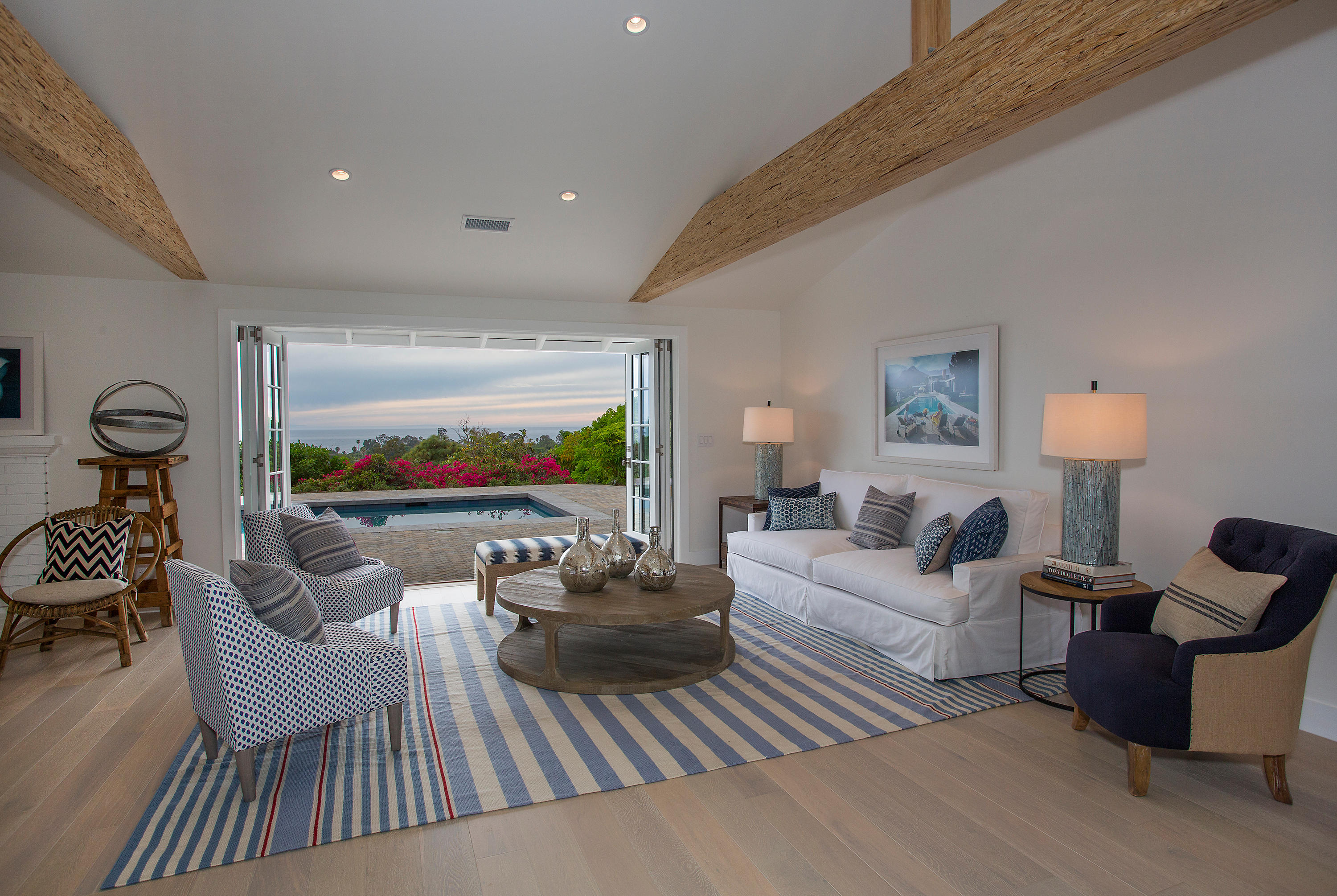 527 Meigs Road Santa Barbara, CA 93109 - Photo 5 of 30 a living room with furniture a rug and a flat screen tv