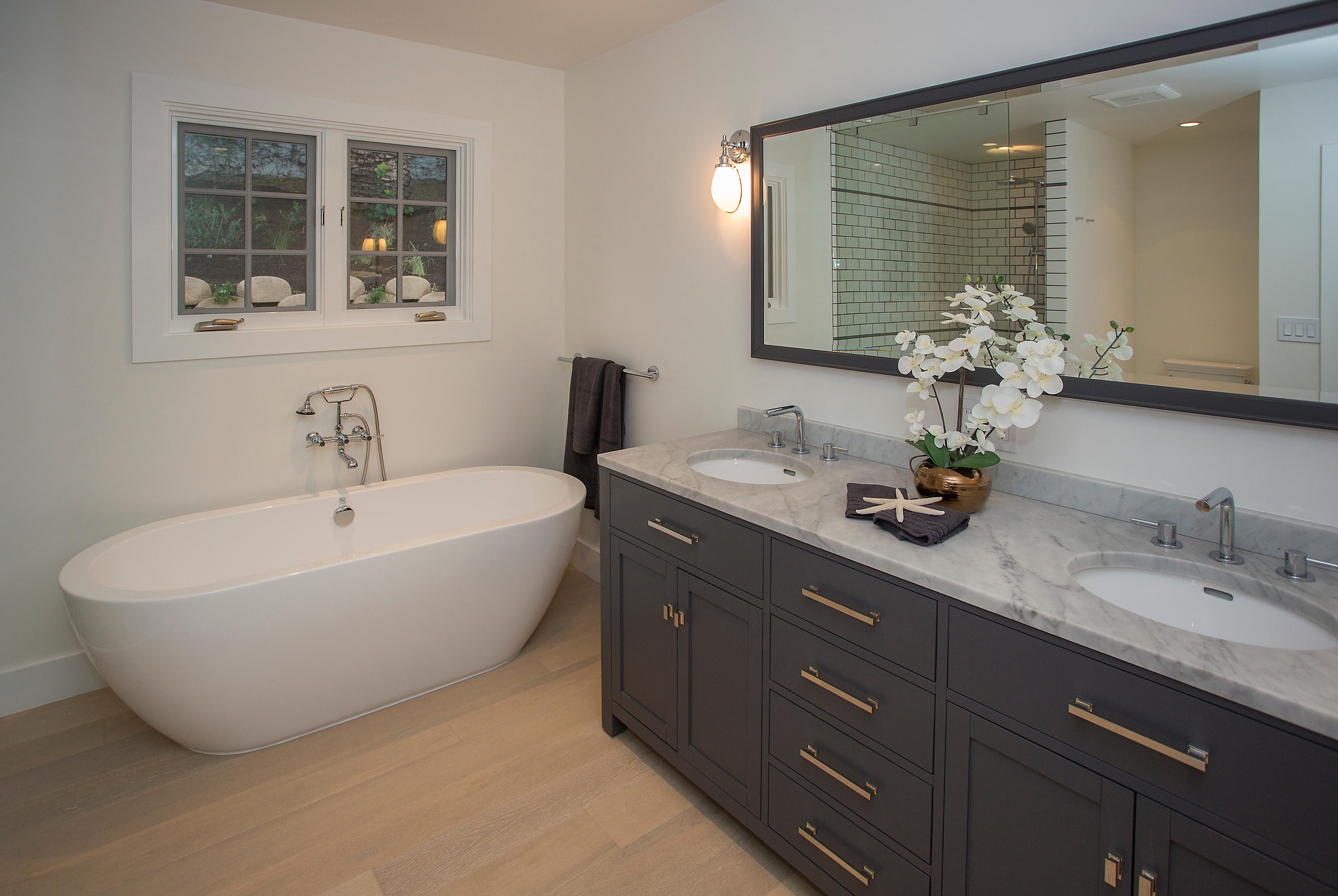 527 Meigs Road Santa Barbara, CA 93109 - Photo 9 of 30 a bathroom with a tub sink and mirror