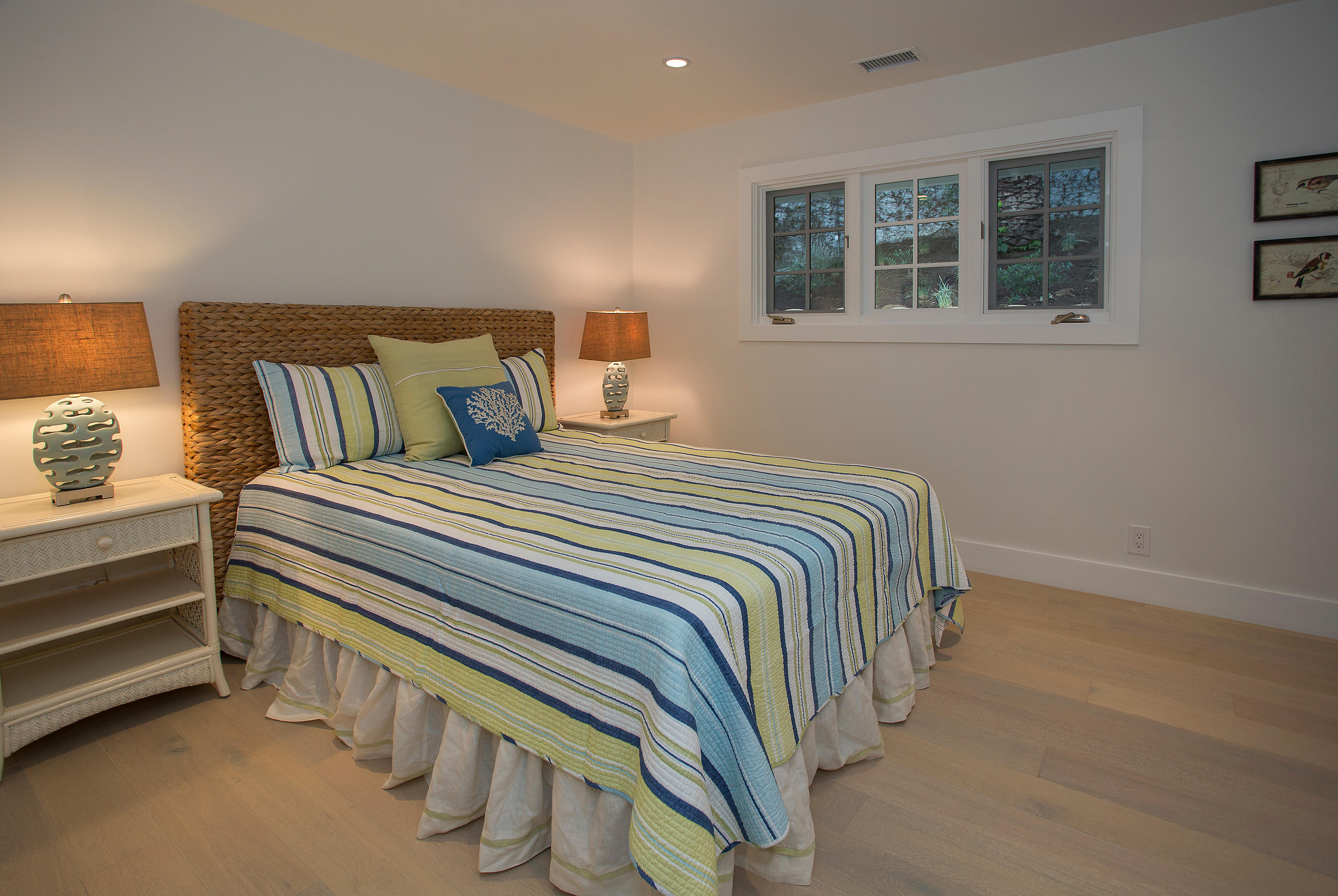 527 Meigs Road Santa Barbara, CA 93109 - Photo 10 of 30 a bedroom with a bed and wooden floor