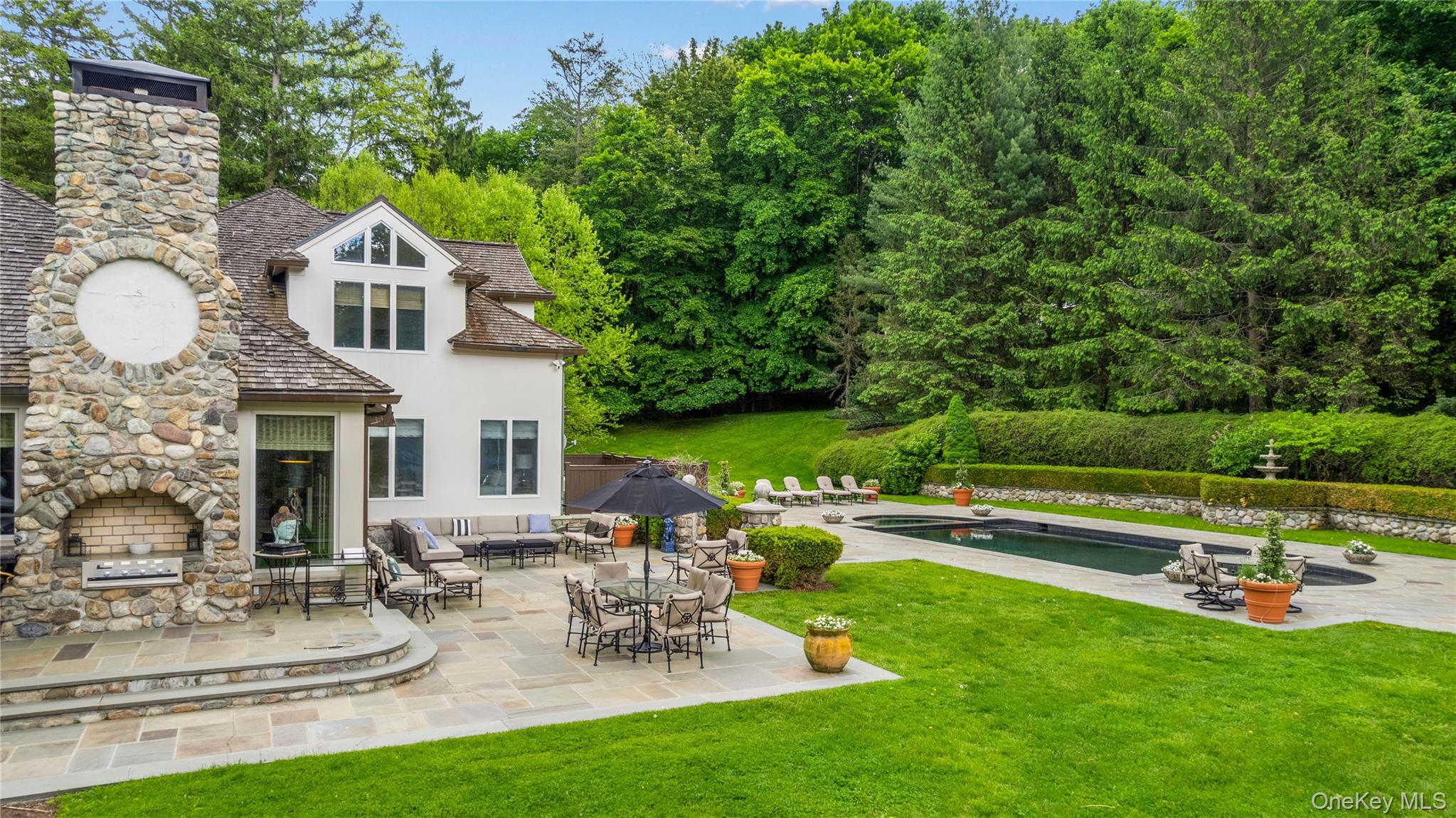 150 Old Farm Road North Chappaqua, NY 10514 - Photo 39 of 44 a front view of house with yard and outdoor seating