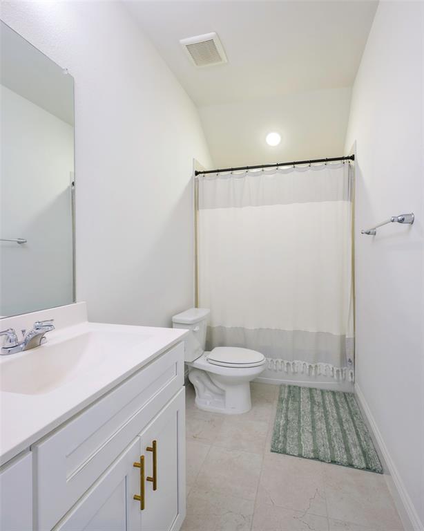 3603 Scotsman Road Sachse, TX 75048 - Photo 20 of 33 a bathroom with a sink a toilet and shower