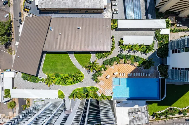 a dining room with furniture a large window and a chandelier